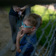Nova, 5, watches their neighbor’s dog on a walk back home from the park.